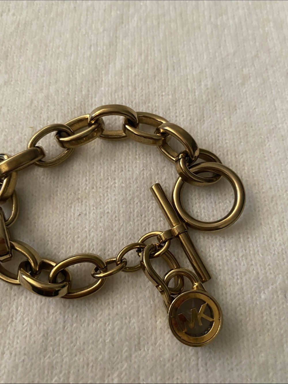 Michael Kors Gold Link Toggle Bracelet with MK Disc Charm toggle closure 8”